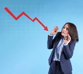 Image of Worried businesswoman and illustration of falling down chart on light blue background. Economy recession concept