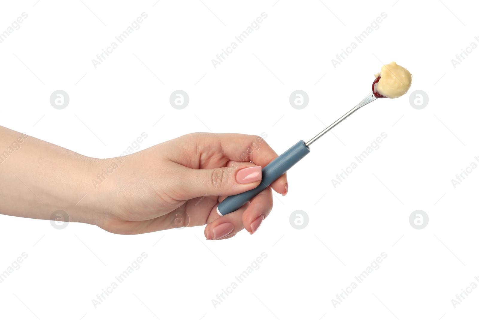 Photo of Tasty fondue. Woman holding fork with grape and melted cheese on white background, closeup