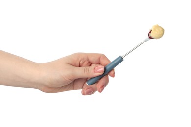 Photo of Tasty fondue. Woman holding fork with grape and melted cheese on white background, closeup