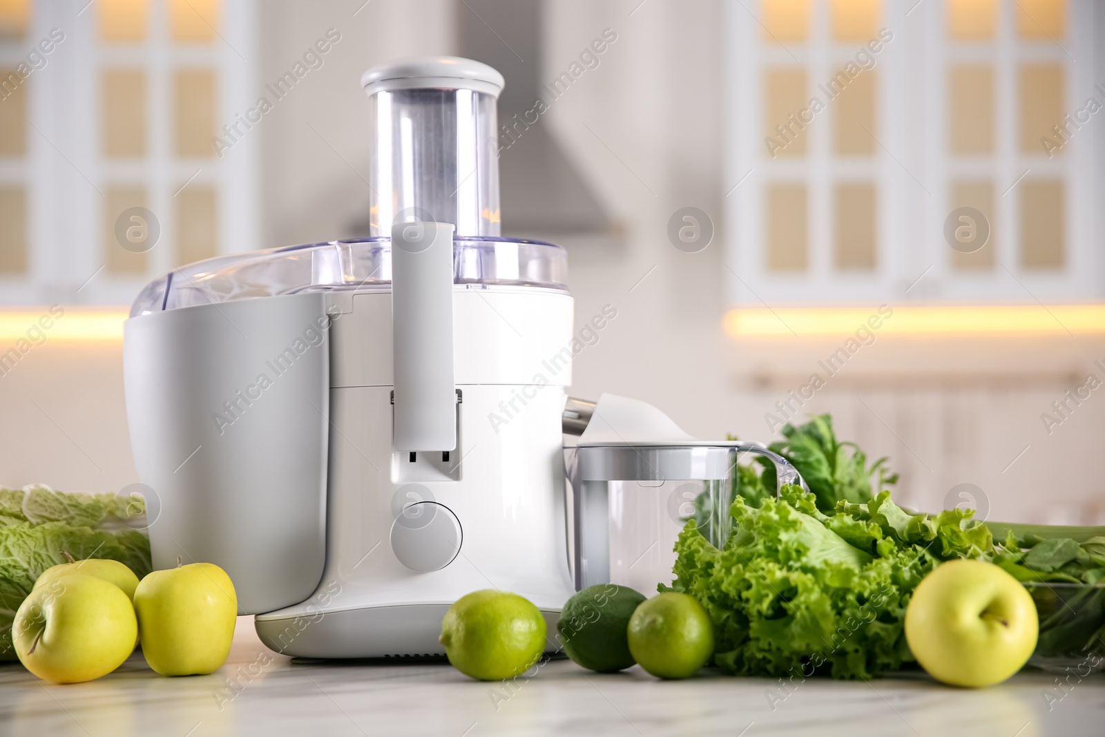 Photo of Modern juicer, fresh vegetables and fruits on table in kitchen