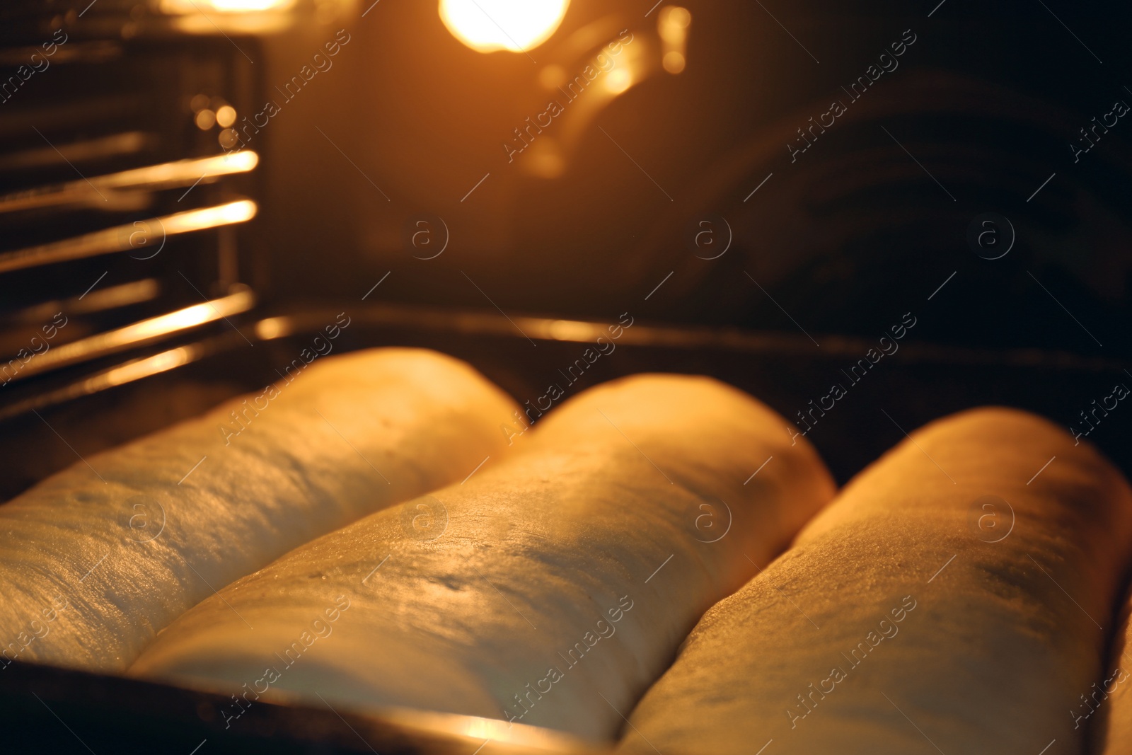 Photo of Baking tasty pastry in oven, closeup view