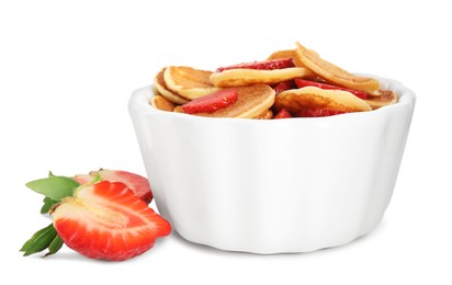 Photo of Delicious mini pancakes cereal with strawberries on white background