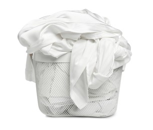 Photo of Laundry basket with clean clothes isolated on white