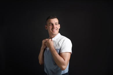 Photo of Portrait of handsome man on black background