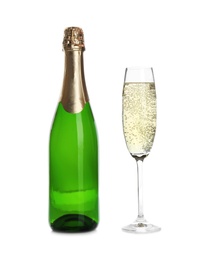 Photo of Bottle and glass with champagne on white background. Festive drink