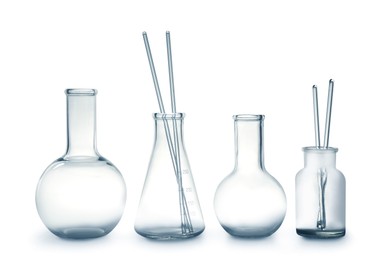 Photo of Empty clean laboratory glassware on white background