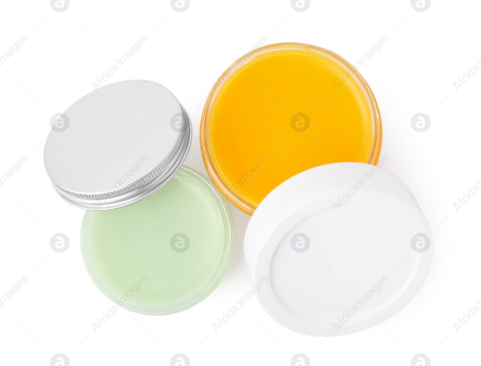 Photo of Jars of cosmetic petrolatum isolated on white, top view