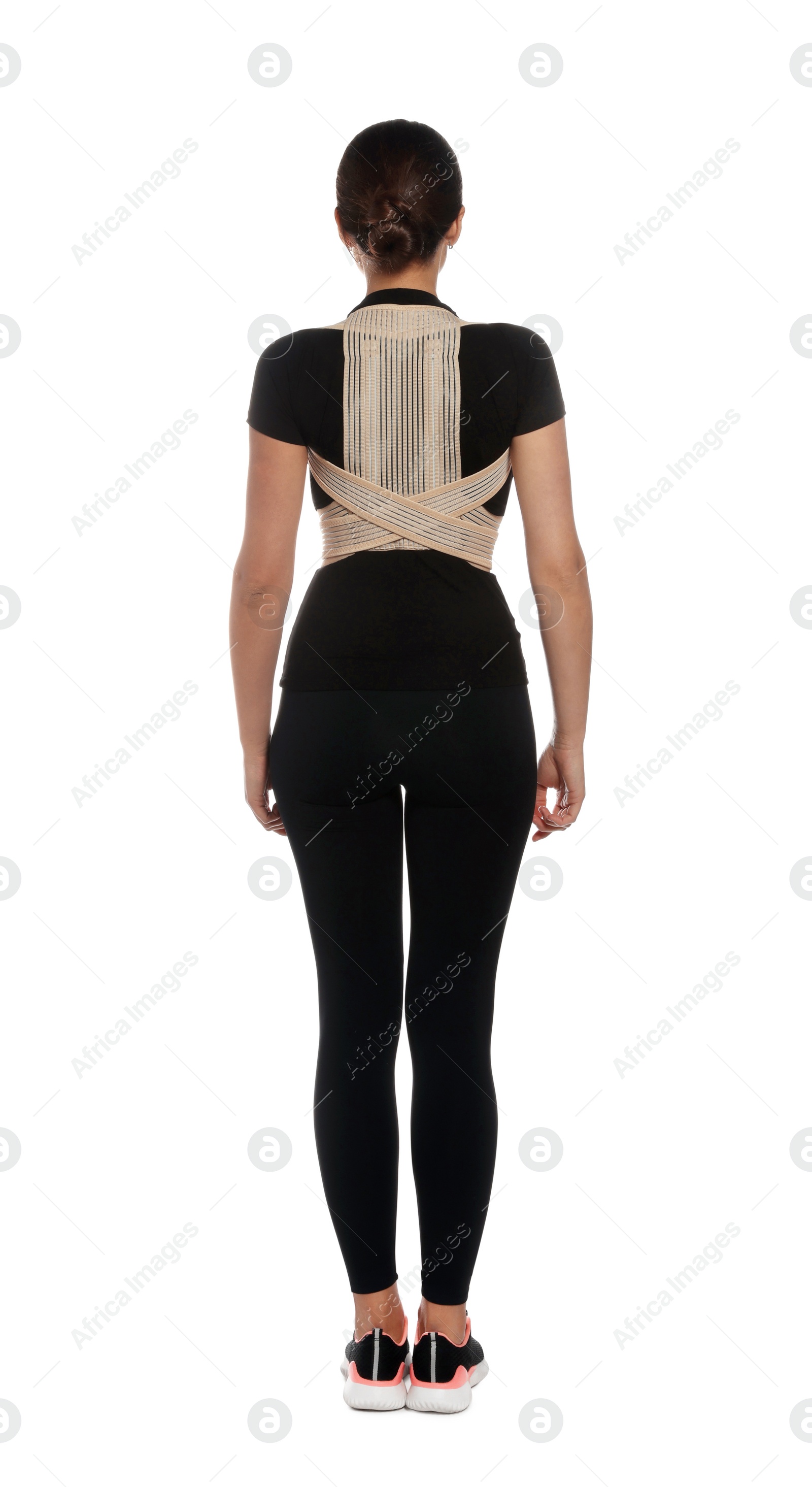 Photo of Woman with orthopedic corset on white background, back view