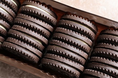 Box with chocolate and cream cookies, top view