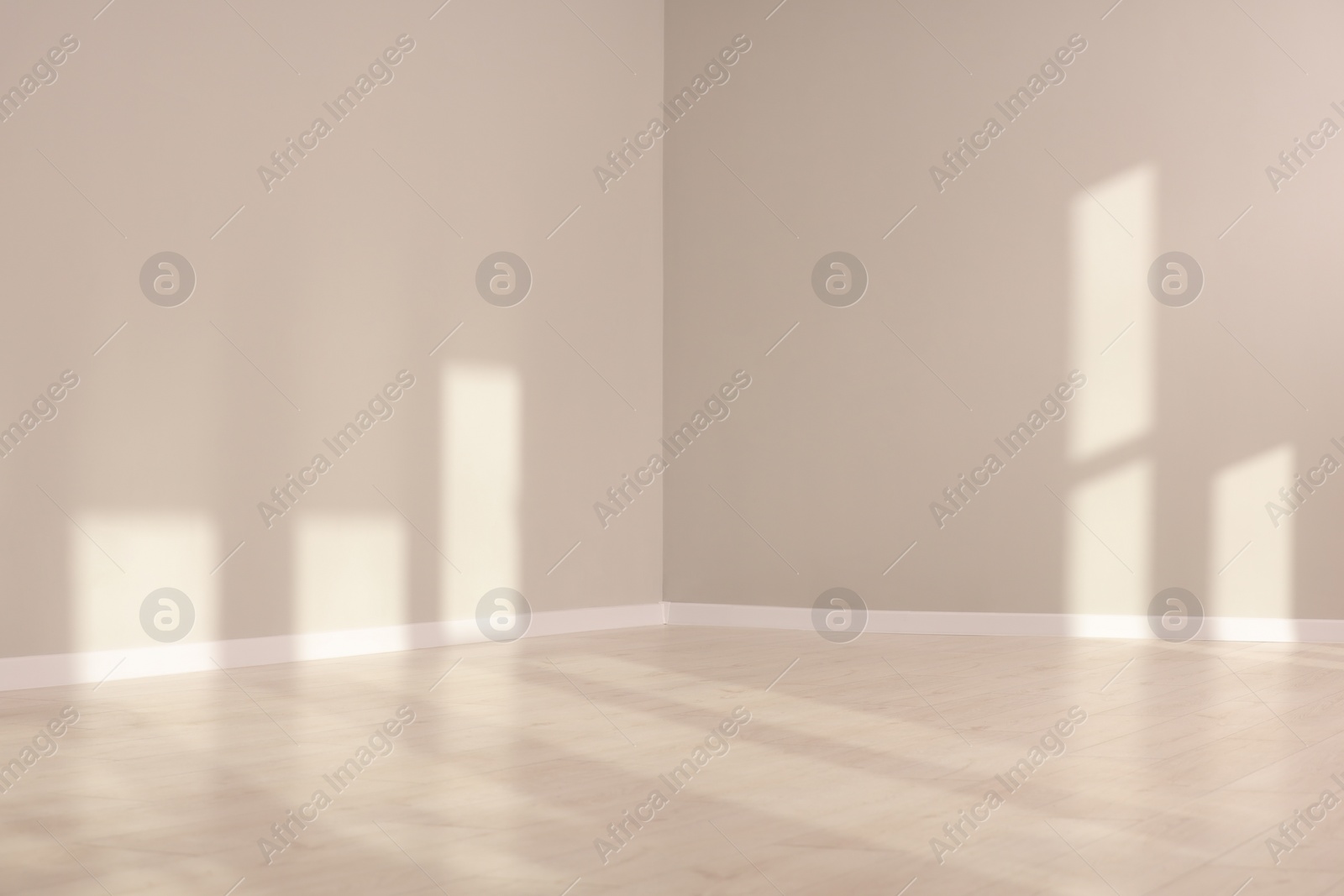 Photo of Light and shadows from window on floor and walls indoors