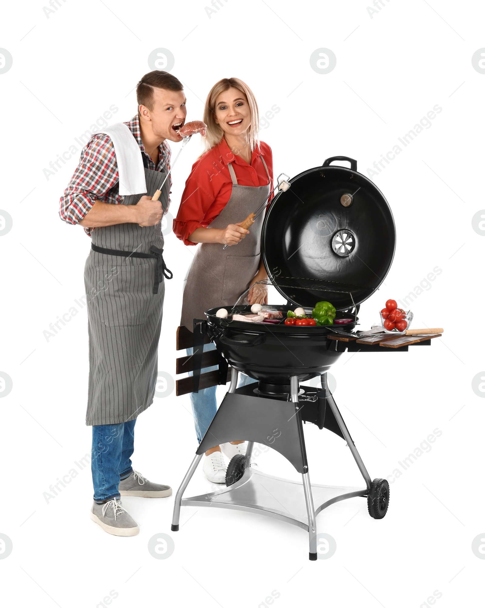 Photo of Happy couple cooking on barbecue grill, white background