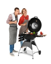 Happy couple cooking on barbecue grill, white background