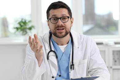 Photo of Portrait of doctor with stethoscope in clinic