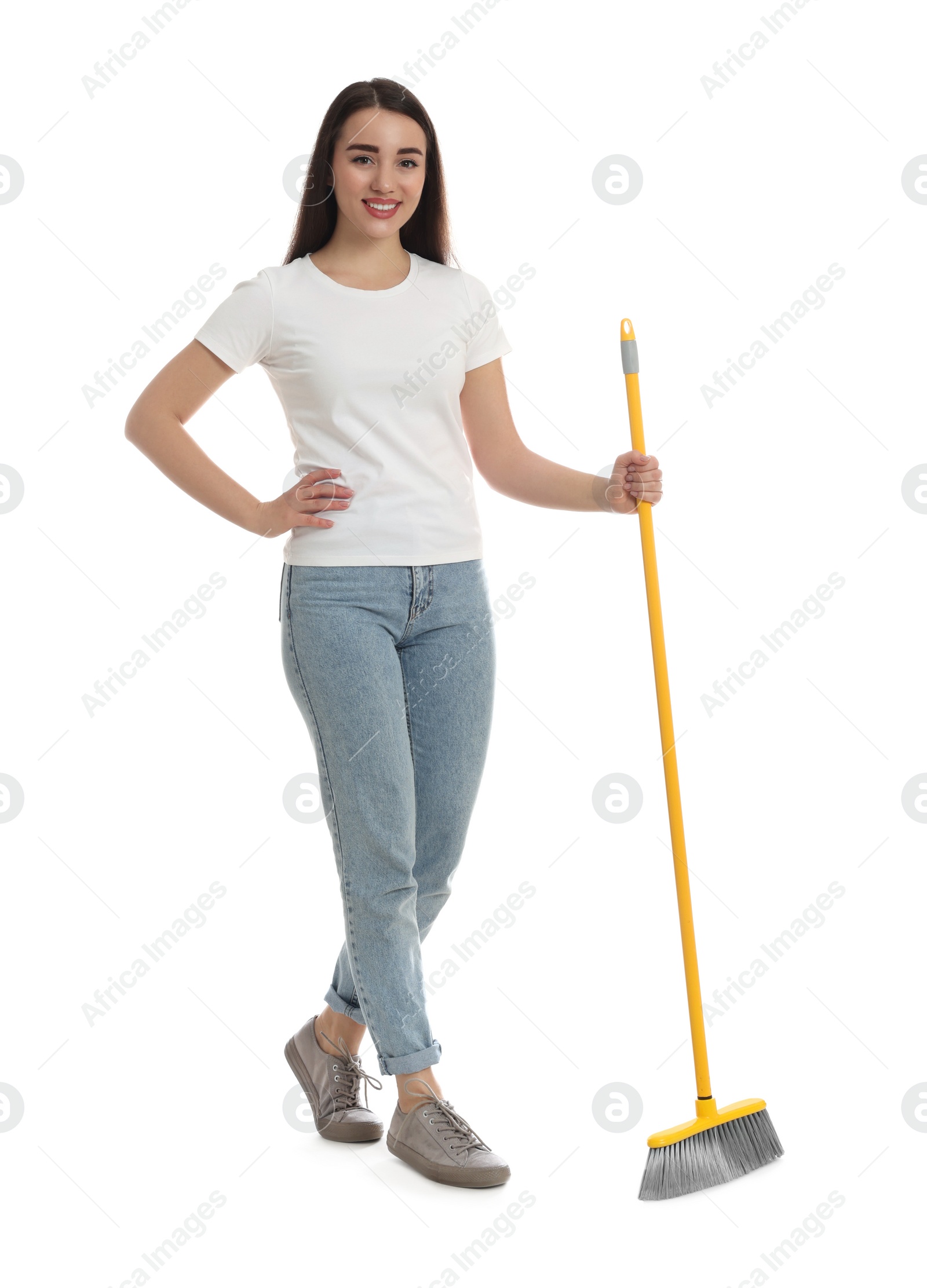 Photo of Beautiful young woman with broom on white background