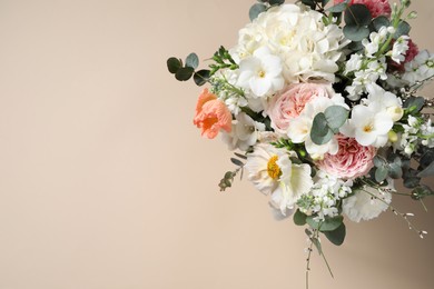 Photo of Bouquet of beautiful flowers on beige background, top view. Space for text