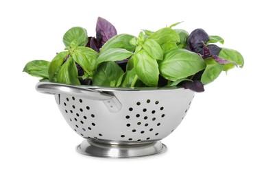 Photo of Metal colander with fresh basil leaves isolated on white