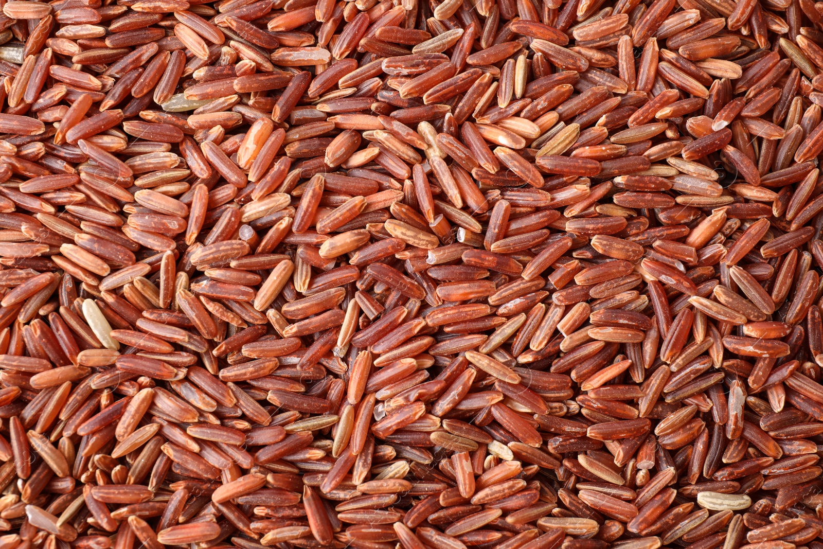 Photo of Closeup view of brown rice as background