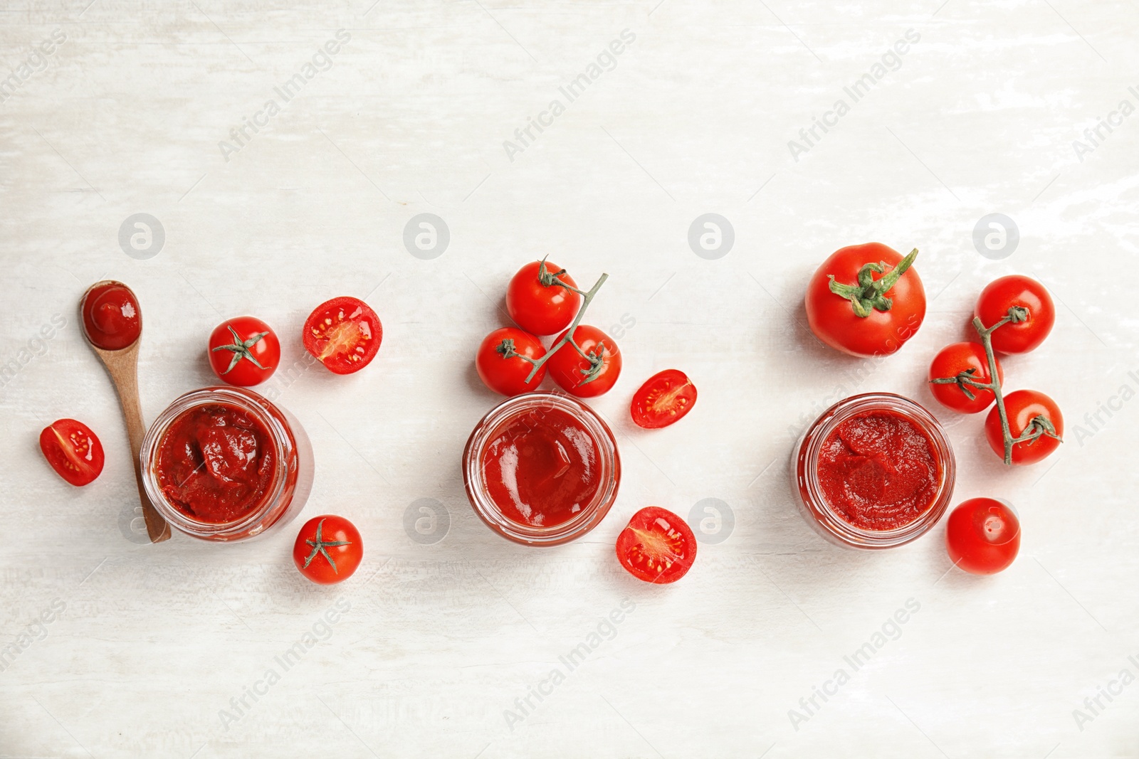 Photo of Composition with tasty homemade tomato sauce on white background, top view