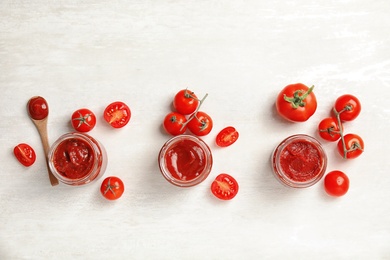 Photo of Composition with tasty homemade tomato sauce on white background, top view