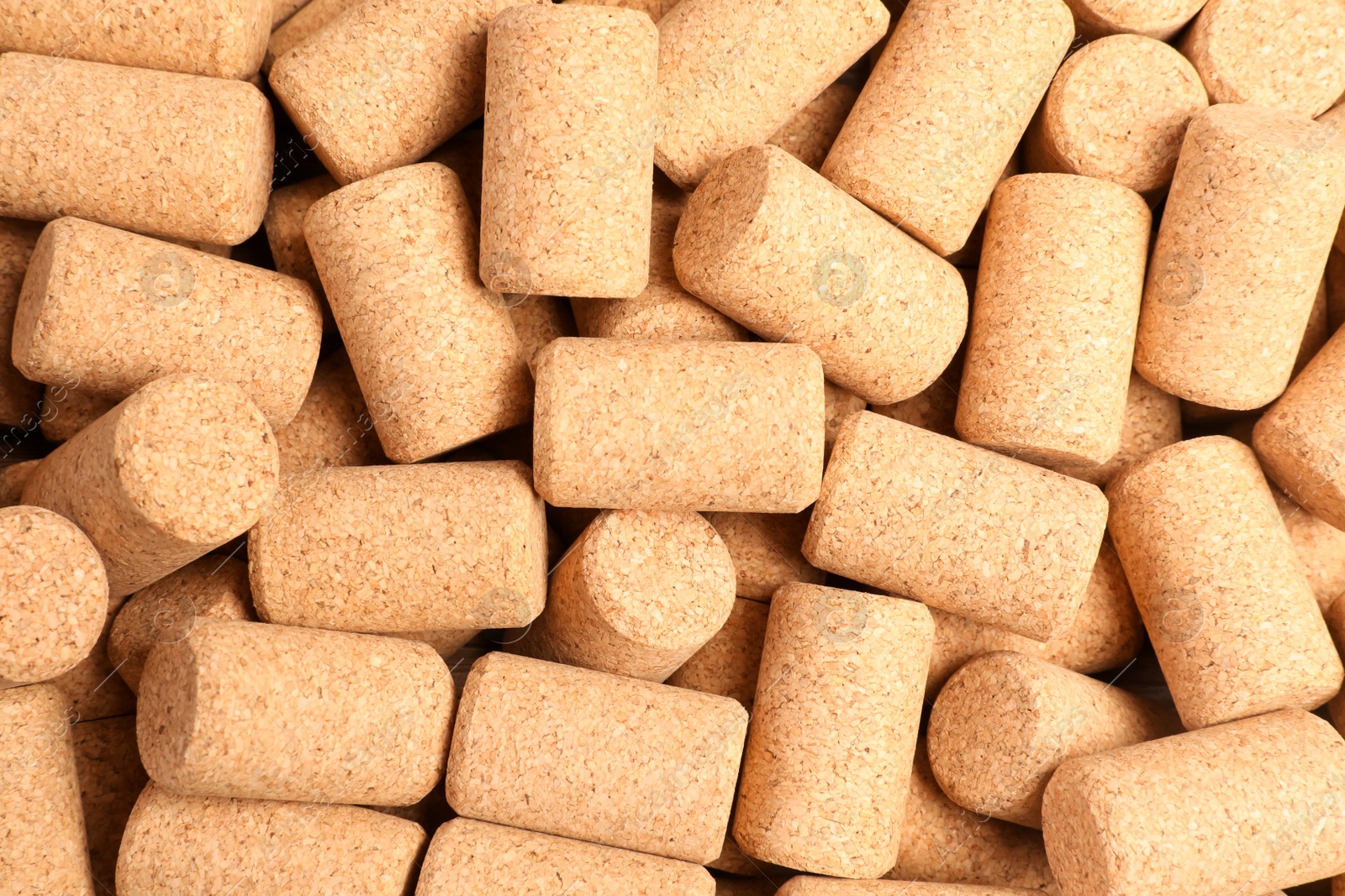 Photo of Many wine bottle corks as background, top view