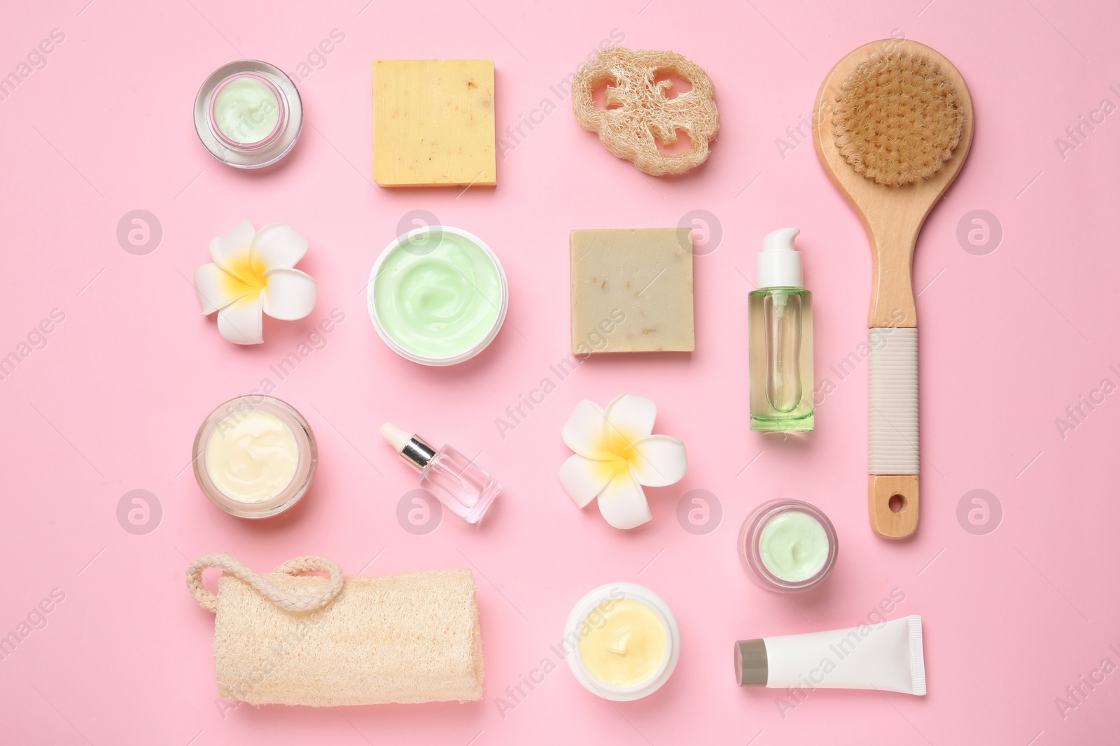 Photo of Flat lay composition with body care products on color background