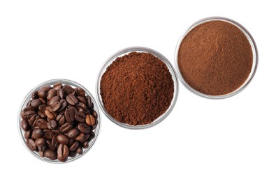 Bowls with different types of coffee on white background, top view