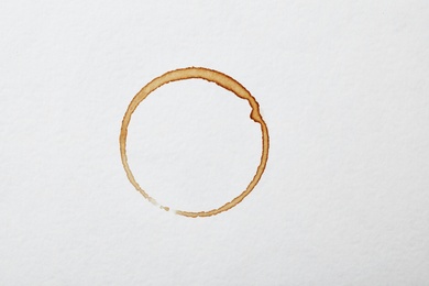 Photo of Dried coffee cup stain on white background, top view