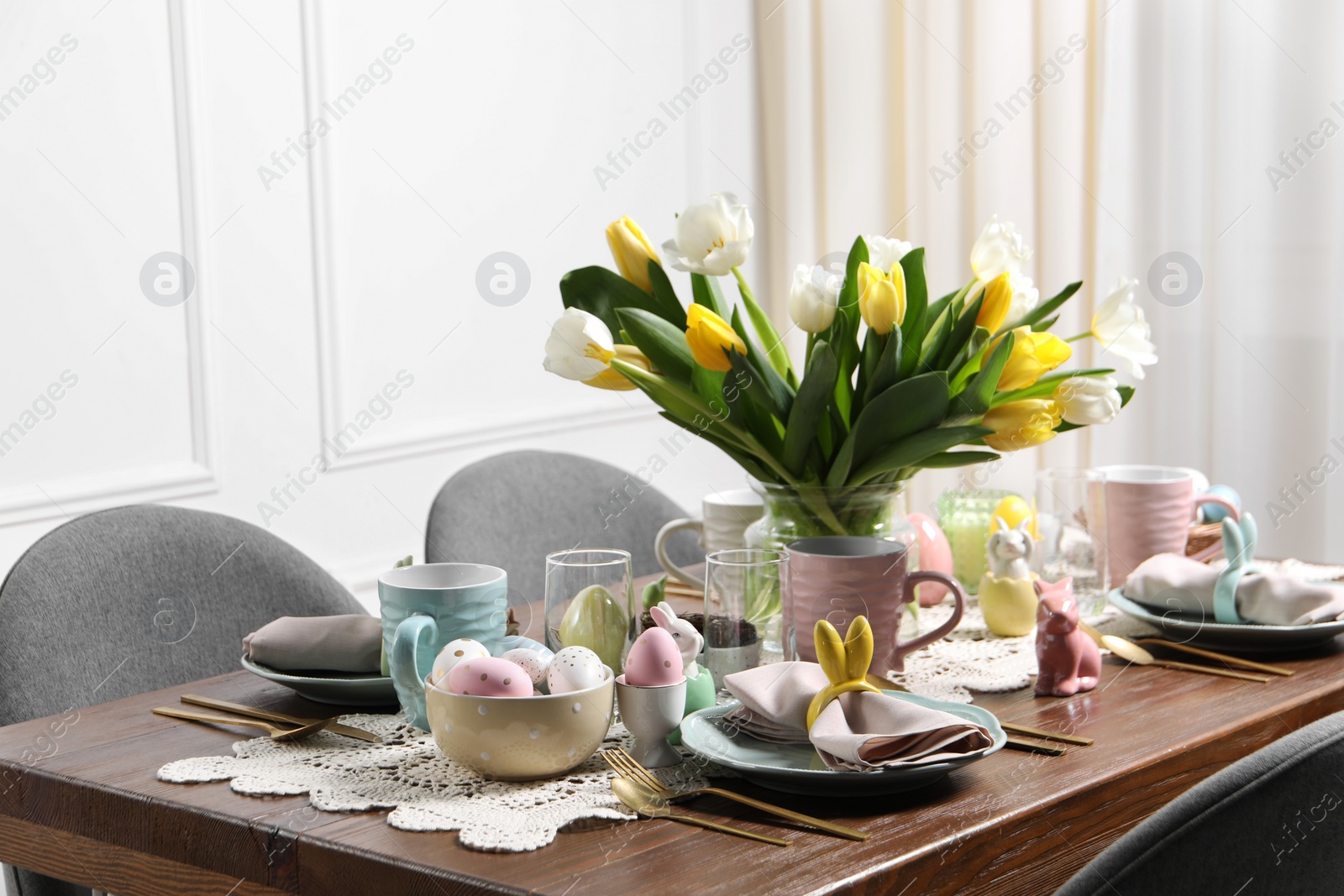 Photo of Festive table setting with beautiful flowers. Easter celebration