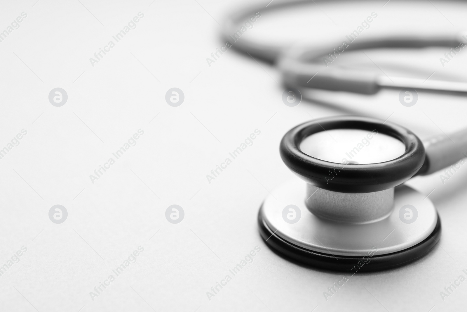 Photo of Stethoscope on white background, closeup. Space for text