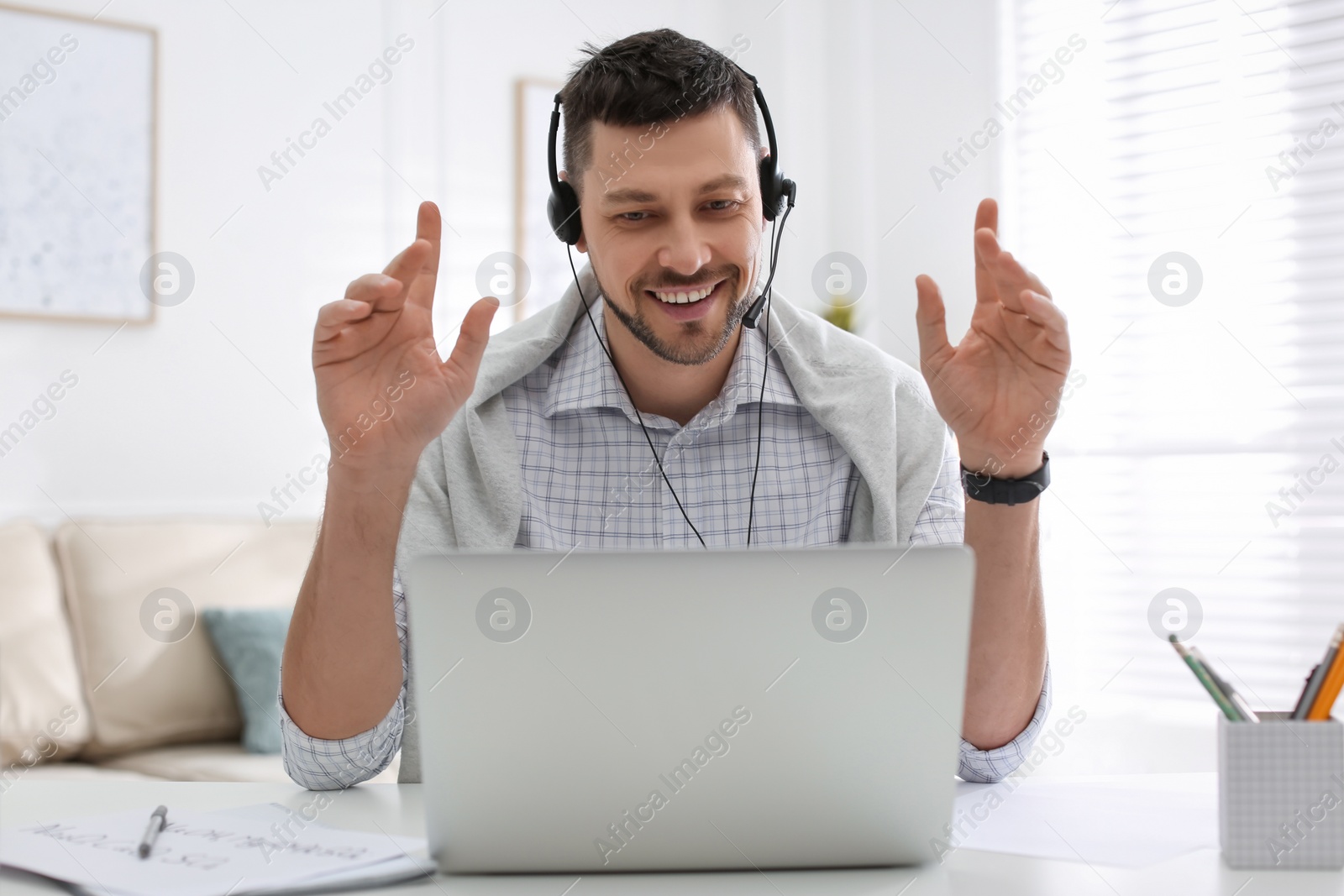 Photo of Teacher conducting online lesson at home during COVID-19 quarantine