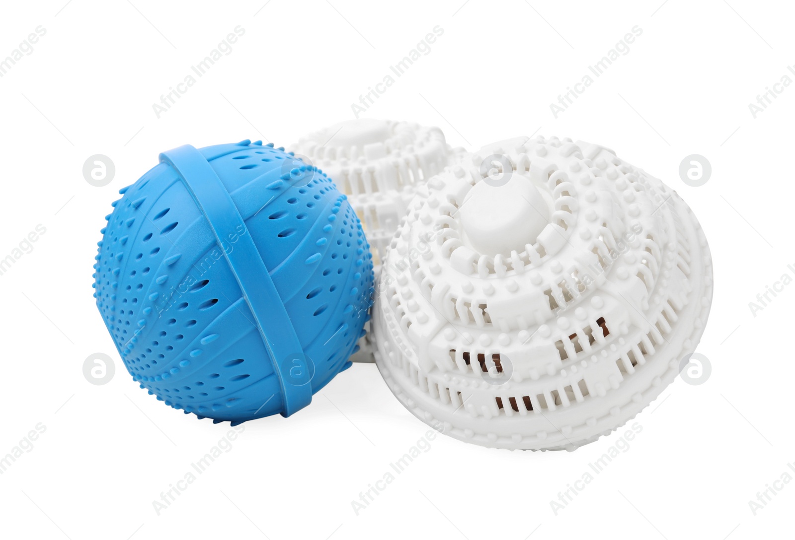 Photo of Many Dryer balls for washing machine on white background. Laundry detergent substitute