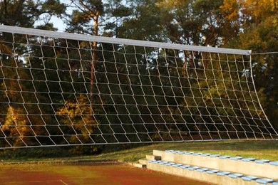 View of volleyball net on court outdoors
