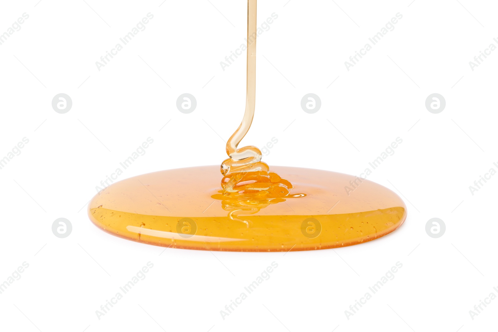 Photo of Pouring tasty natural honey isolated on white