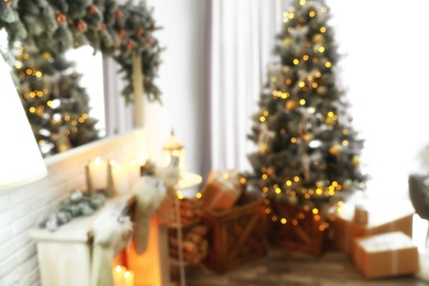 Photo of Blurred view of beautiful Christmas tree in living room interior