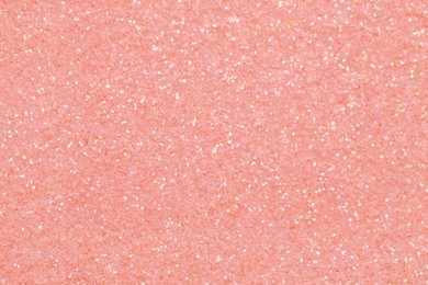 Beautiful pink shiny glitter as background, top view