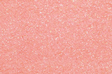 Photo of Beautiful pink shiny glitter as background, top view