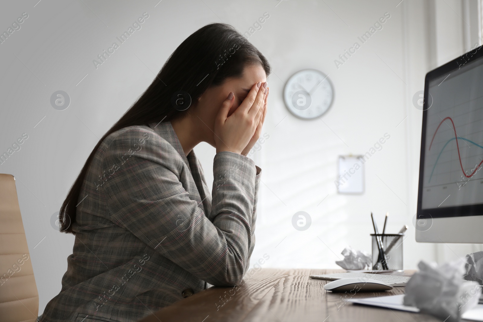 Photo of Businesswoman stressing out at workplace in office