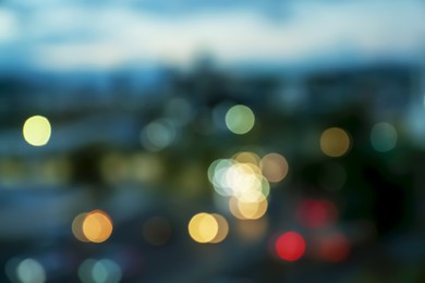 Photo of Blurred view of cityscape in evening. Bokeh effect