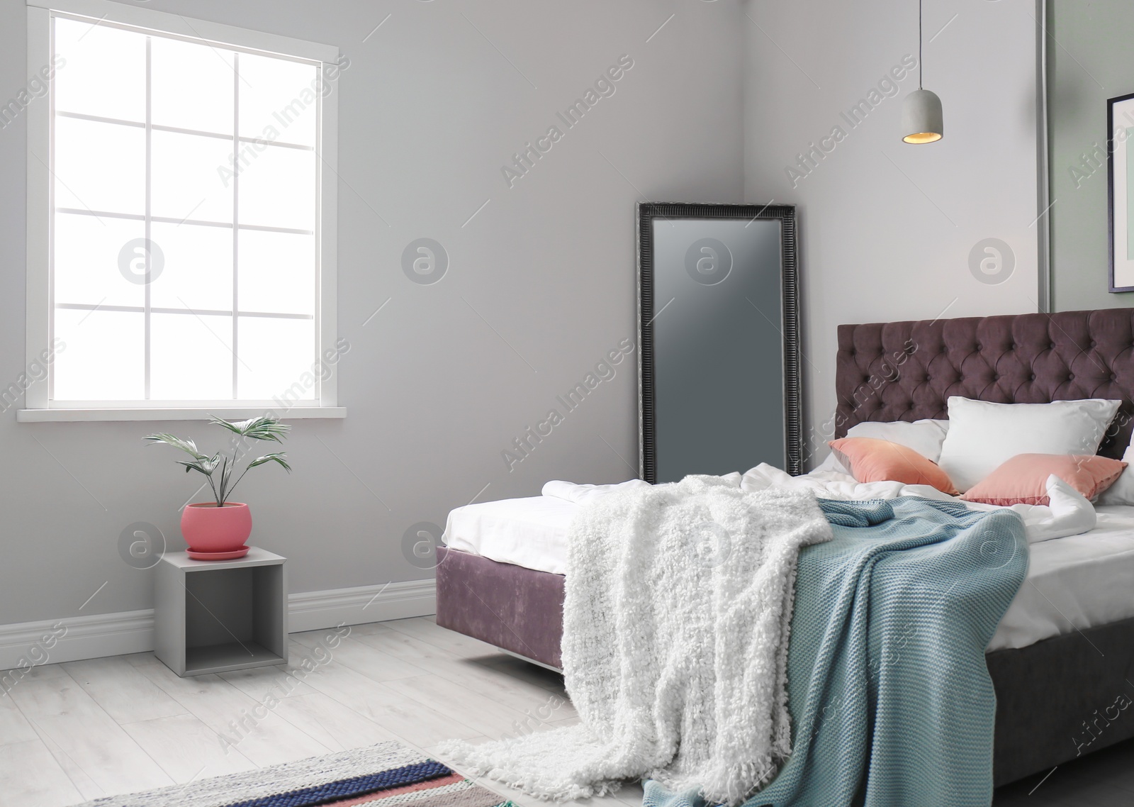 Photo of Stylish room interior with comfortable bed