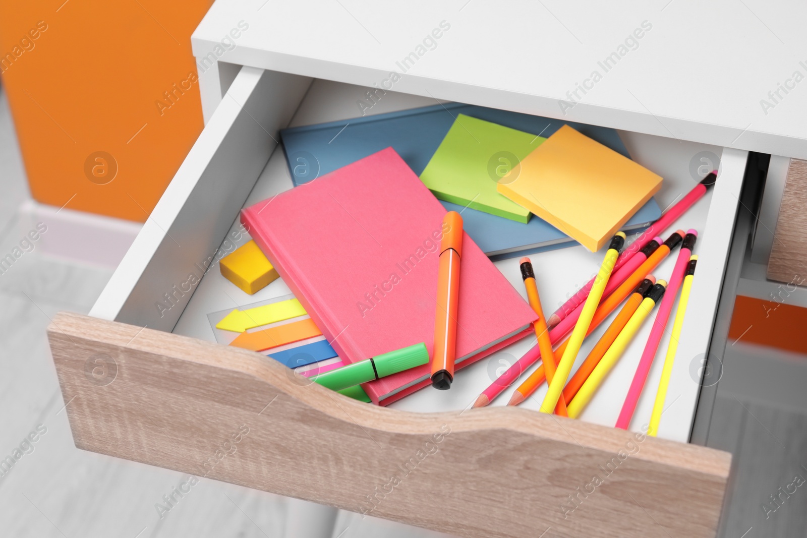 Photo of Office supplies in open desk drawer indoors
