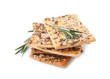 Photo of Stack of cereal crackers with flax, sunflower, sesame seeds and rosemary isolated on white