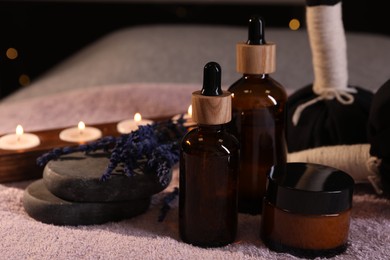 Photo of Composition with spa products and dry lavender flowers on soft light surface