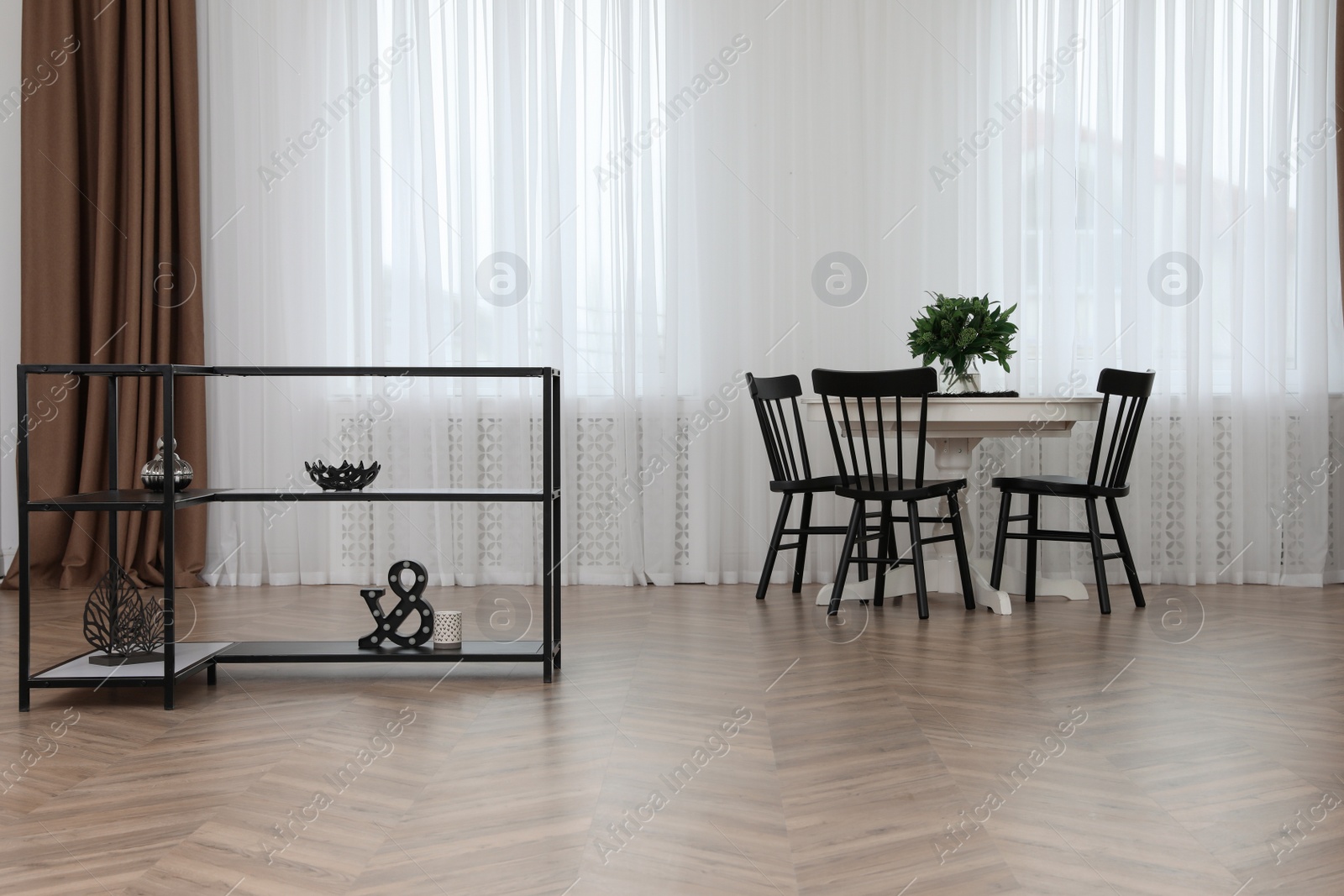 Photo of Modern dining room with parquet flooring and stylish furniture