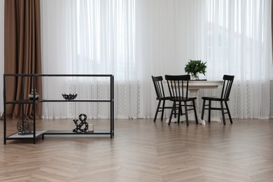 Photo of Modern dining room with parquet flooring and stylish furniture