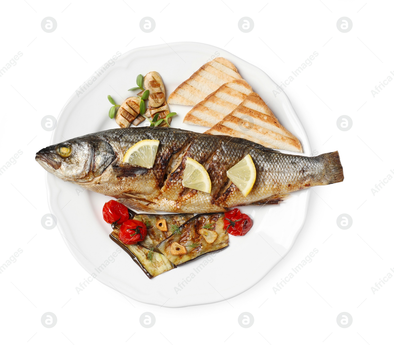 Photo of Plate with delicious sea bass fish and ingredients isolated on white, top view