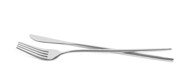 Knife and fork isolated on white. Stylish shiny cutlery set