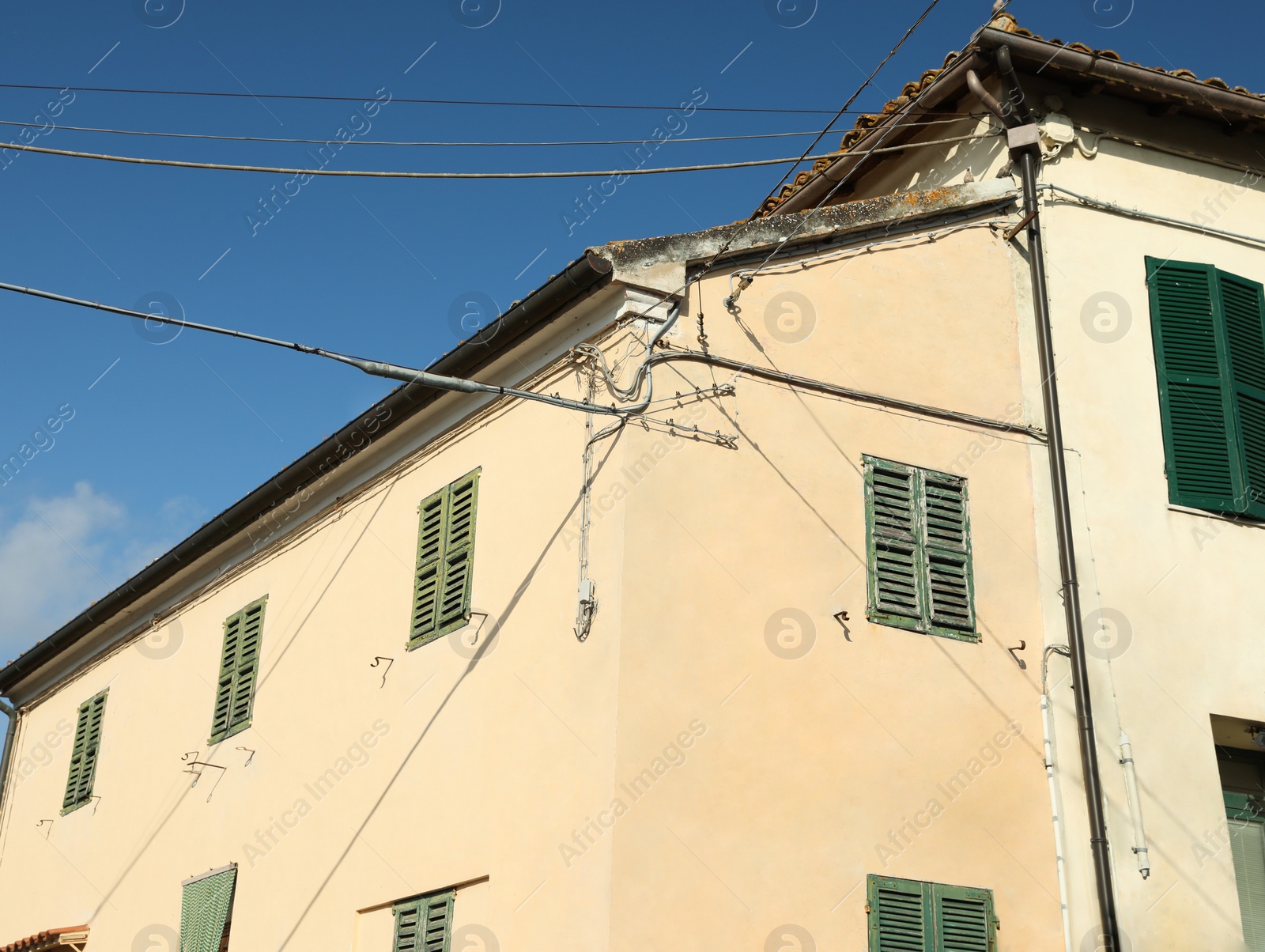 Photo of Residential building against blue sky on sunny day