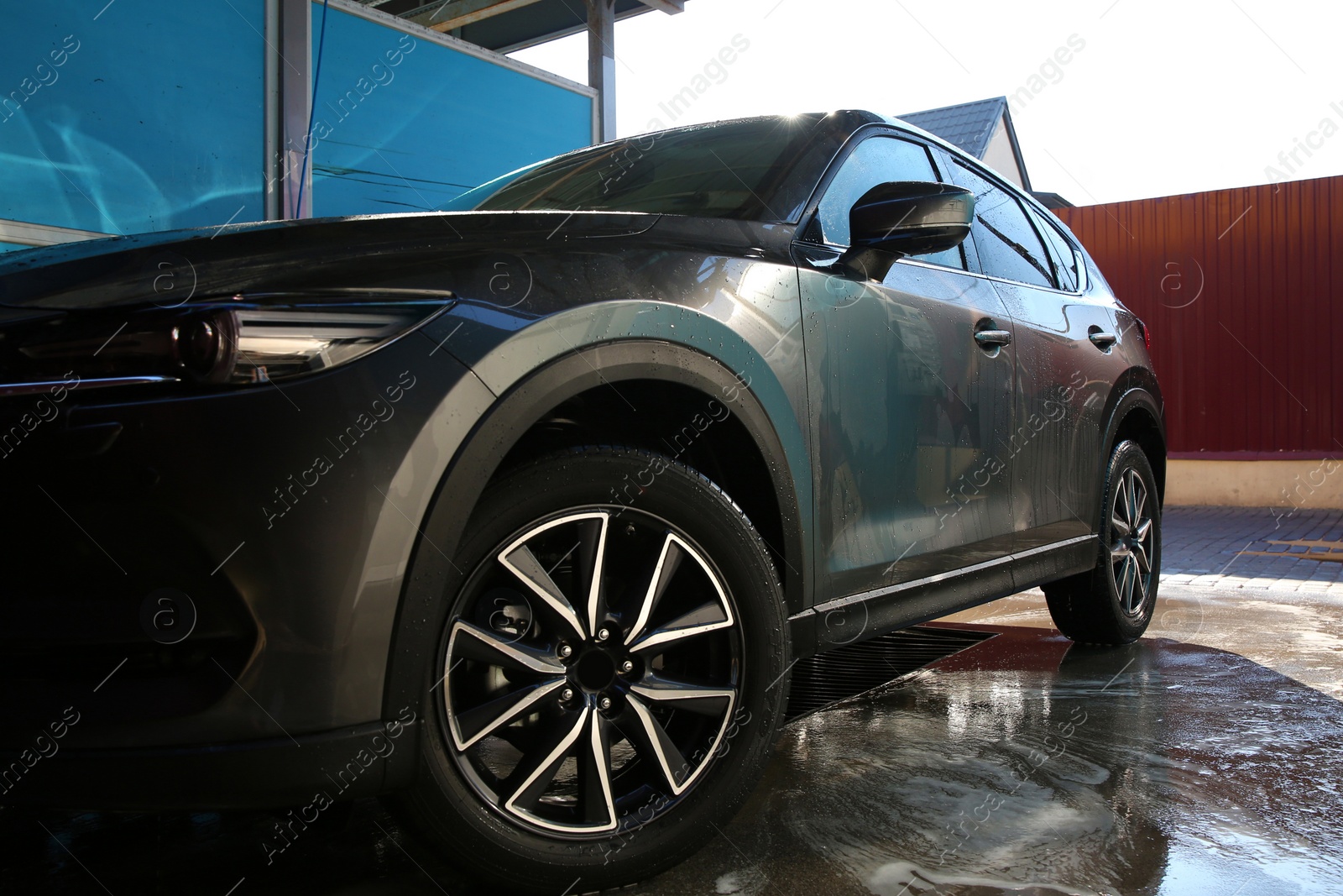 Photo of Clean wet automobile at professional car wash