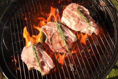 Photo of Cooking meat on barbecue grill outdoors, top view