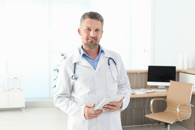 Male medical assistant in clinic. Health care service